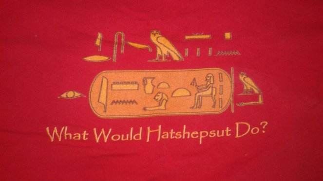 A close-up of one of my T-shirts, which says "What Would Hatshepsut Do?"